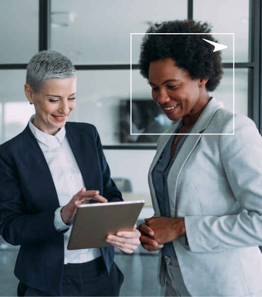 two happy workers looking at tablet