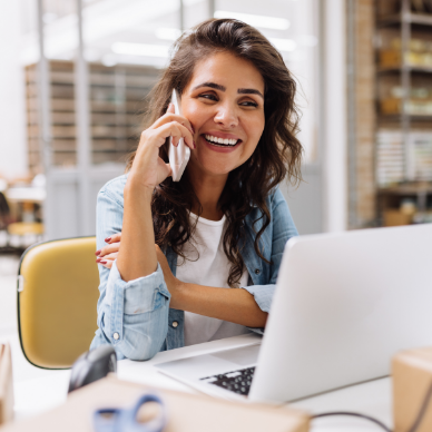 smiling woman talking on phone