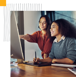two people looking at computer