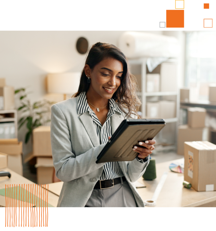 woman in suit using tablet inside of office